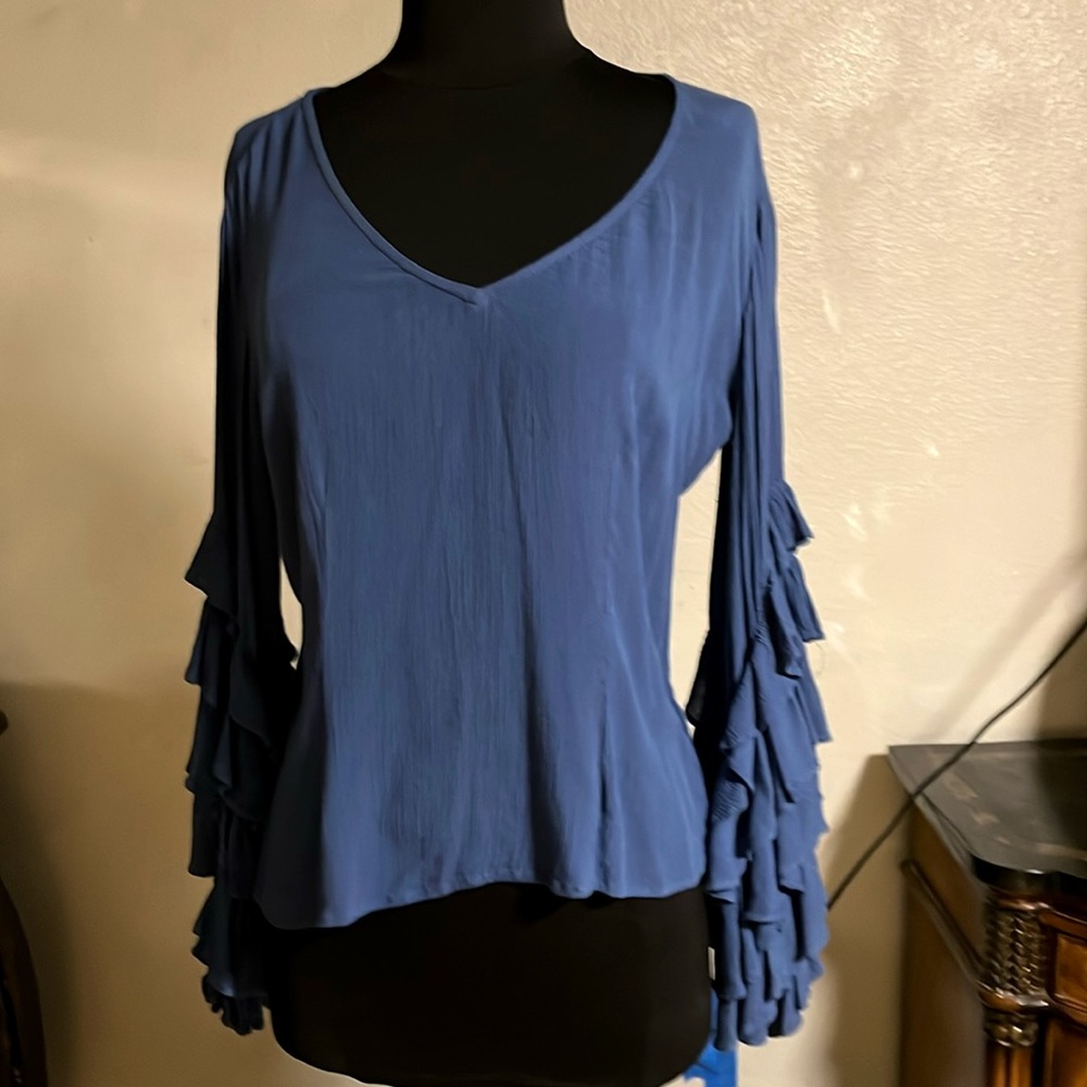 Woman’s blouse, blue with ruffled sleeves